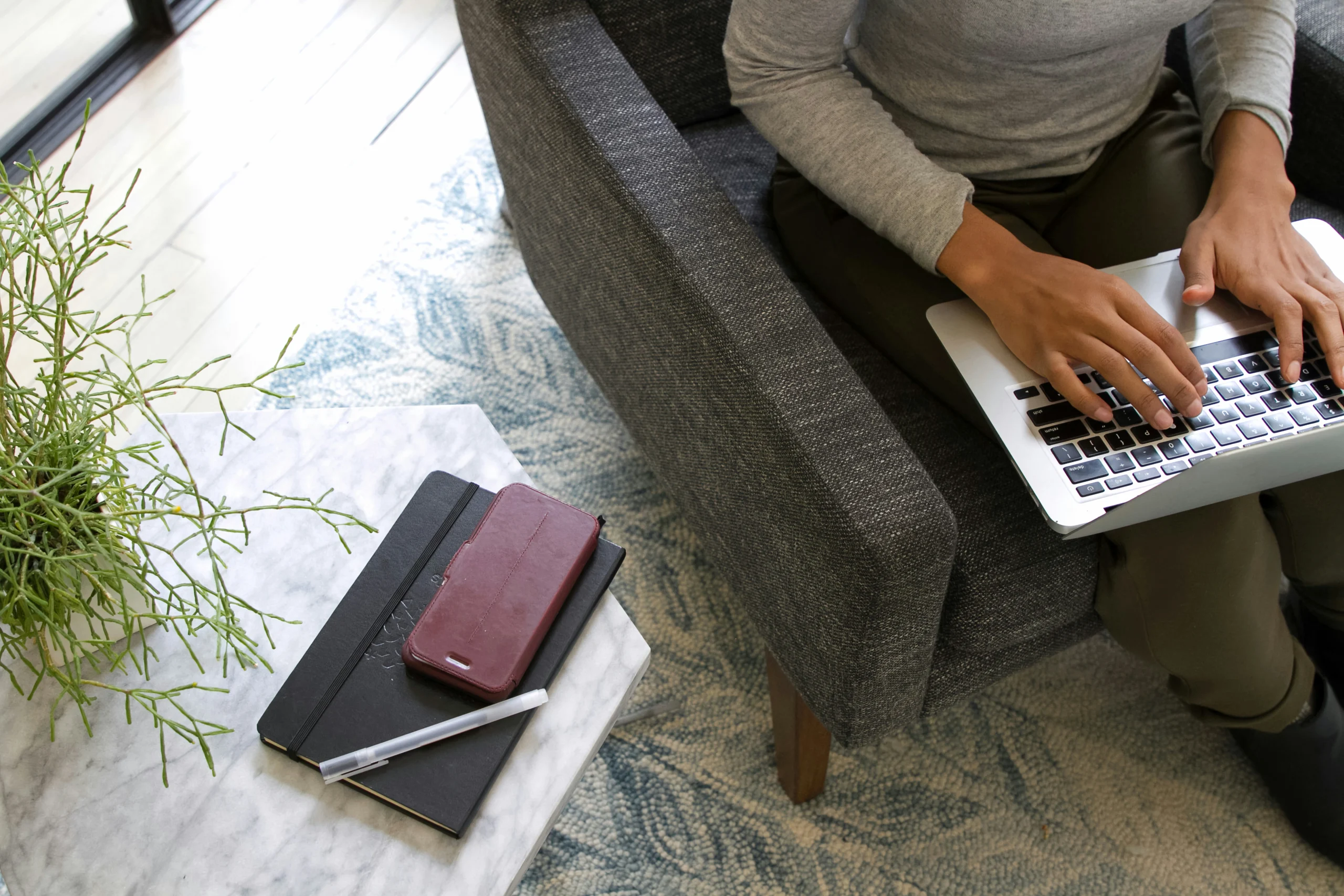 Small Business Owner working on their website SEO on a laptop sitting on their lap