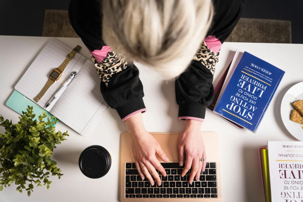 Small Business Owner working on SEO on laptop on Desk